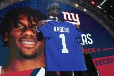 An image of Malik Nabers on the draft stage with his Giants Jersey.